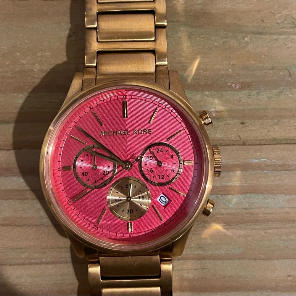 Michael Kors coral dial Gold Tone Watch.